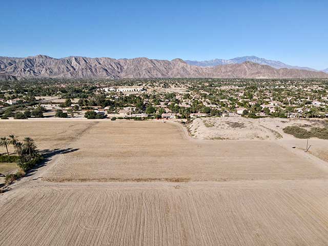 grading the site with mountain views.